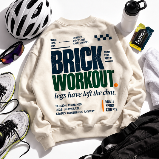 Race Scoop Brick Workout cream crewneck flat lay featuring multisport training gear for swim, bike and run endurance workouts.