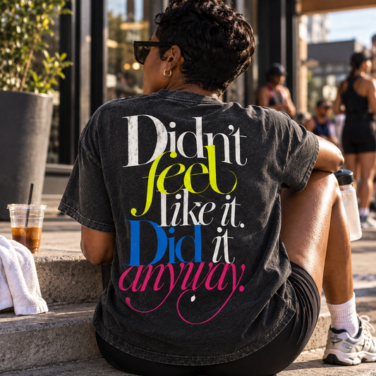 Race Scoop Didn’t Feel Like It black graphic tee worn by an athlete relaxing after a run, featuring bold statement back artwork about showing up and doing it anyway.