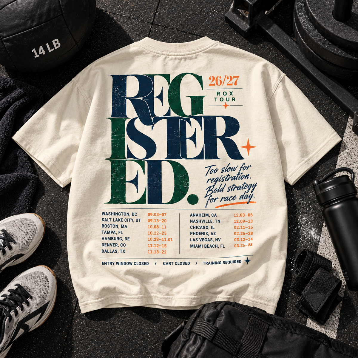 Race Scoop Registered 26/27 ROX Tour cream graphic tee flat lay featuring functional fitness training gear and bold competition inspired back artwork.