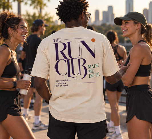 Race Scoop Run Club Made Me Do It cream graphic tee worn at a social run club meetup, featuring statement back artwork inspired by running community and accountability.