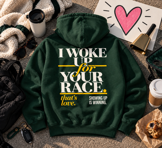Race Scoop I Woke Up For Your Race green hoodie styled with race day support essentials, featuring bold back artwork celebrating the people who show up for their athletes.